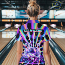 Load image into Gallery viewer, Women’s neon cosmic bowling polo shirt, back view on female model in bowling lane 