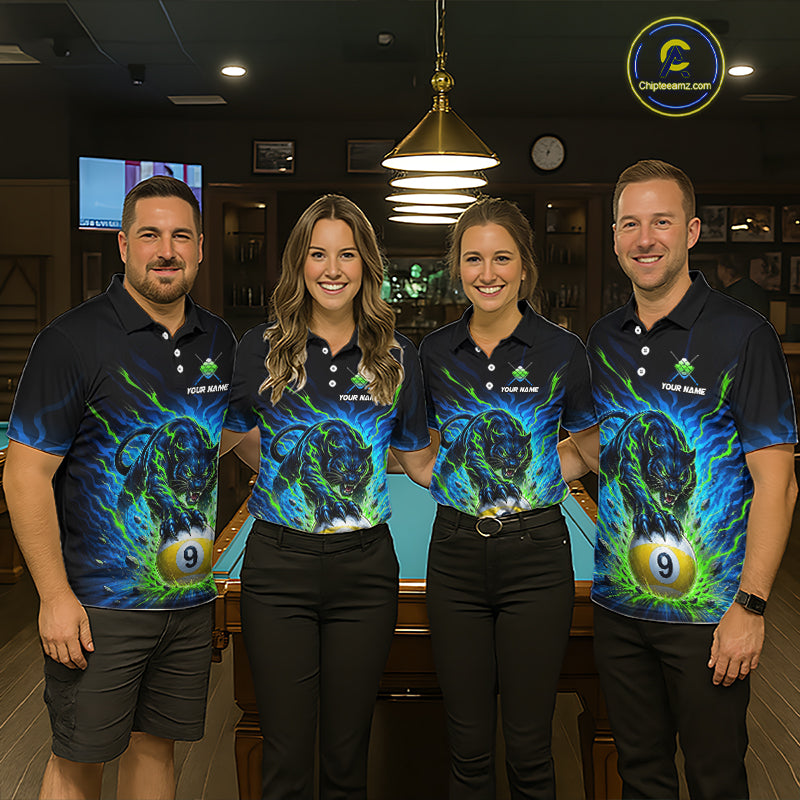 Four people wearing matching polo shirts with a pool ball and snake design in a bar setting.