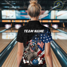 Load image into Gallery viewer, Women’s us flag raccoon bowling quarter zip shirt, back view on female model in bowling lane 