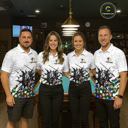 Four people wearing matching billiard themed shirts in a billiard alley.