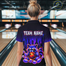 Load image into Gallery viewer, Women wearing bowling polo shirt featuring a raccoon holding a bowling ball framed by pins with purple city skyline background.