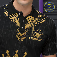 Load image into Gallery viewer, Personalized bowling polo shirt with a crowned bowling ball centered among geometric gold patterns across a black layout.