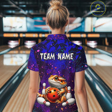 Load image into Gallery viewer, Women’s funny bearded dragon bowling polo shirt, back view on female model in bowling lane 