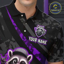Load image into Gallery viewer, Black camouflage polo shirt with raccoon graphics and customizable text on a dark background