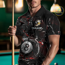 Load image into Gallery viewer, Man wearing a black collared polo shirt with shattered glass graphics, red accent streaks, a custom name area, and a large cracked 8-ball illustration across the lower front.