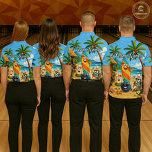Load image into Gallery viewer, Four people wearing matching blue bowling shirts with a colorful design on a bowling alley.