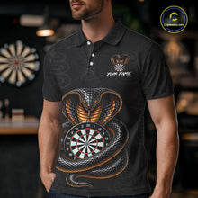 Load image into Gallery viewer, Man wearing darts polo shirt featuring a cobra wrapped around a dartboard with detailed cobra snake on a black background.