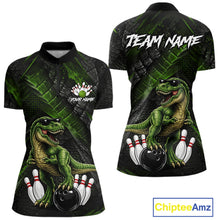 Load image into Gallery viewer, Front and back bowling quarter zip shirt featuring a dinosaur standing among bowling pins and ball artwork on black green textured background.