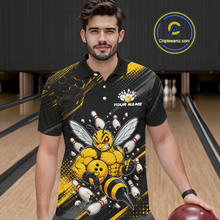 Load image into Gallery viewer, Man wearing bowling polo shirt featuring a muscular bee holding a bowling ball surrounded by pins on black yellow background.