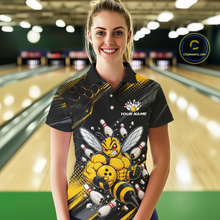 Load image into Gallery viewer, Women wearing bowling polo shirt featuring a muscular bee holding a bowling ball surrounded by pins on black yellow background.