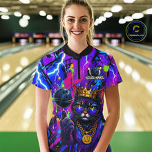 Load image into Gallery viewer, Women wearing personalized bowling quarter zip shirt with a crowned cat holding a bowling ball, blended with colorful paint strokes and graphic patterns.