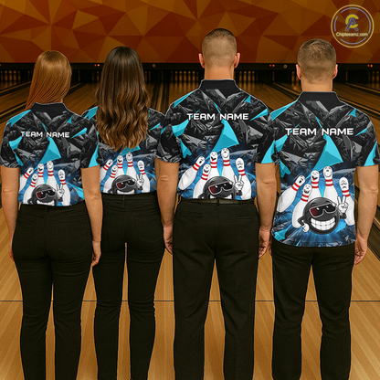 Four people standing with their backs to the camera in a bowling alley, wearing matching custom bowling shirts with a blue and black geometric pattern and bowling pin graphics. The shirts have 'TEAM NAME' printed on the back.