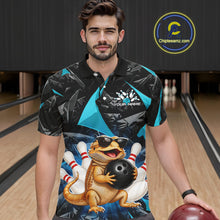 Load image into Gallery viewer, Men’s turquoise bearded dragon bowling polo shirt, front view on male model in bowling lane 