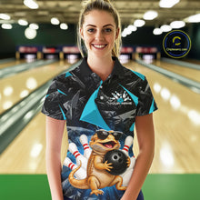 Load image into Gallery viewer, Women’s turquoise bearded dragon bowling polo shirt, front view on female model in bowling lane 