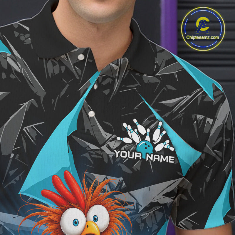 A close-up of a person wearing a black short-sleeve polo shirt with a gray cracked-plate style print, bright turquoise side panels, bowling pins and a bowling ball graphic on the chest, and a cartoon orange-red bird character at the bottom. The shirt includes the text 'YOUR NAME' and a visible 'ChipteeAmz.