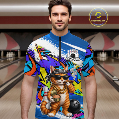 Man wearing a colorful bowling quarter zip shirt with a cat design in a bowling alley.