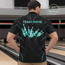 Load image into Gallery viewer, Person wearing a black bowling shirt with teal graphics and 'TEAM NAME' text at a bowling alley.
