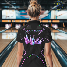 Load image into Gallery viewer, Person wearing a black bowling shirt with colorful design and 'TEAM NAME' text in a bowling alley.