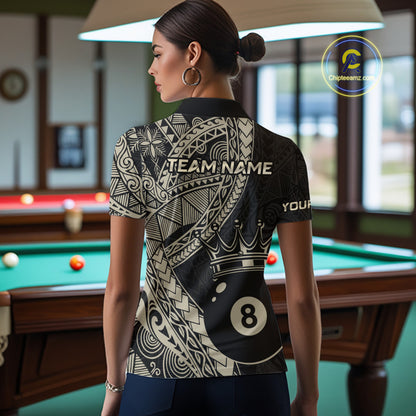 Woman wearing a black and gold patterned shirt with 'TEAM NAME' and number '8' in a pool hall.