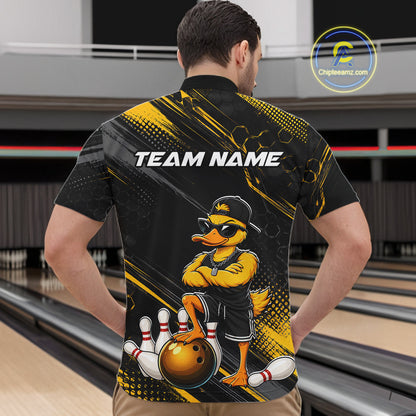 Person wearing a black and yellow bowling shirt with a cartoon duck character on a bowling alley.