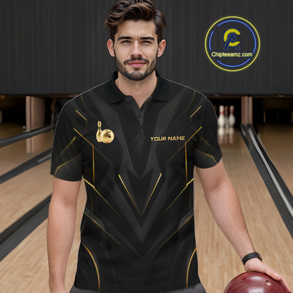 Man wearing a black bowling shirt with gold accents in a bowling alley.