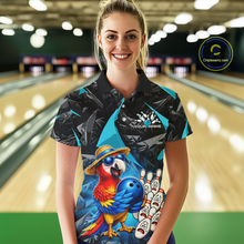 Load image into Gallery viewer, Woman wearing a colorful bowling shirt with a parrot design in a bowling alley.