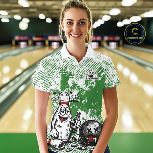 Female model at a bowling lane wearing a green and white polo shirt, funny drunk bowling pin artwork holding beer and bowling ball.