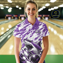 Load image into Gallery viewer, Woman wearing a purple and white bowling shirt with a shark design in a bowling alley.