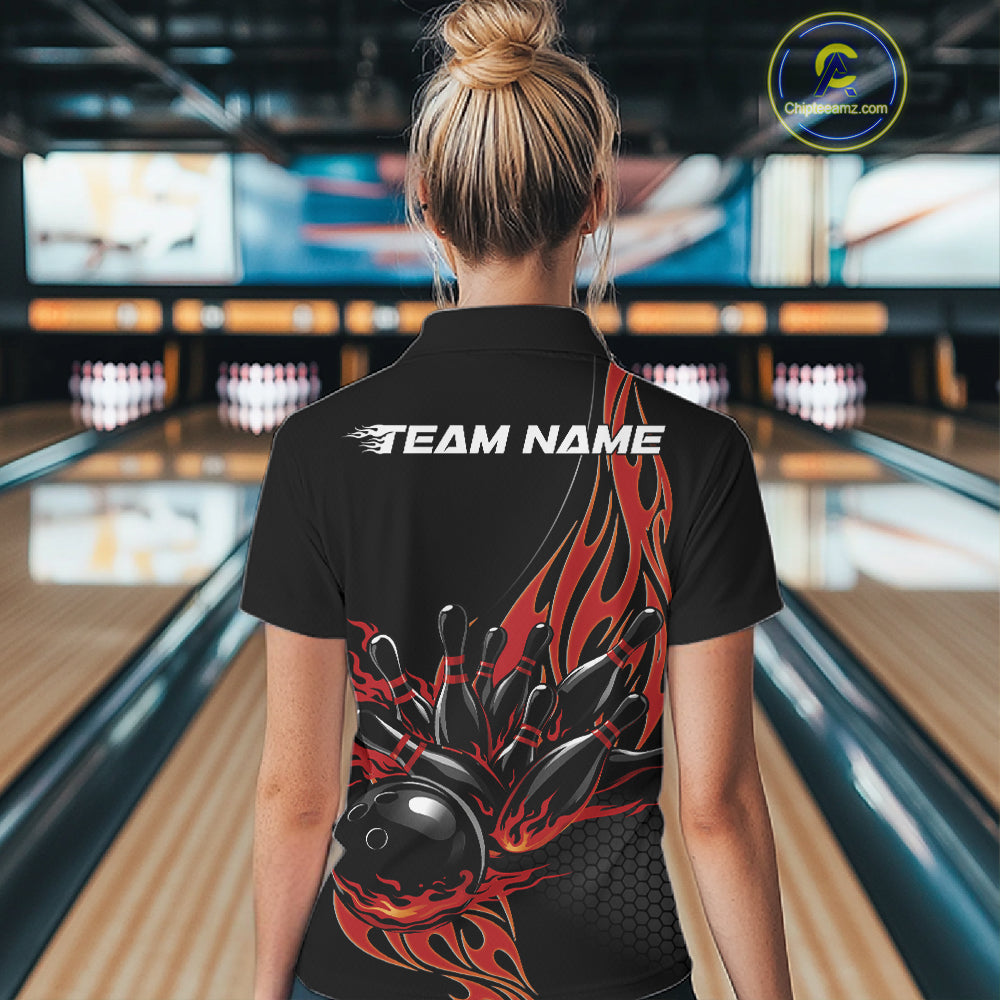 Back view female model in bowling alley wearing black quarter zip shirt with red flaming bowling action illustration