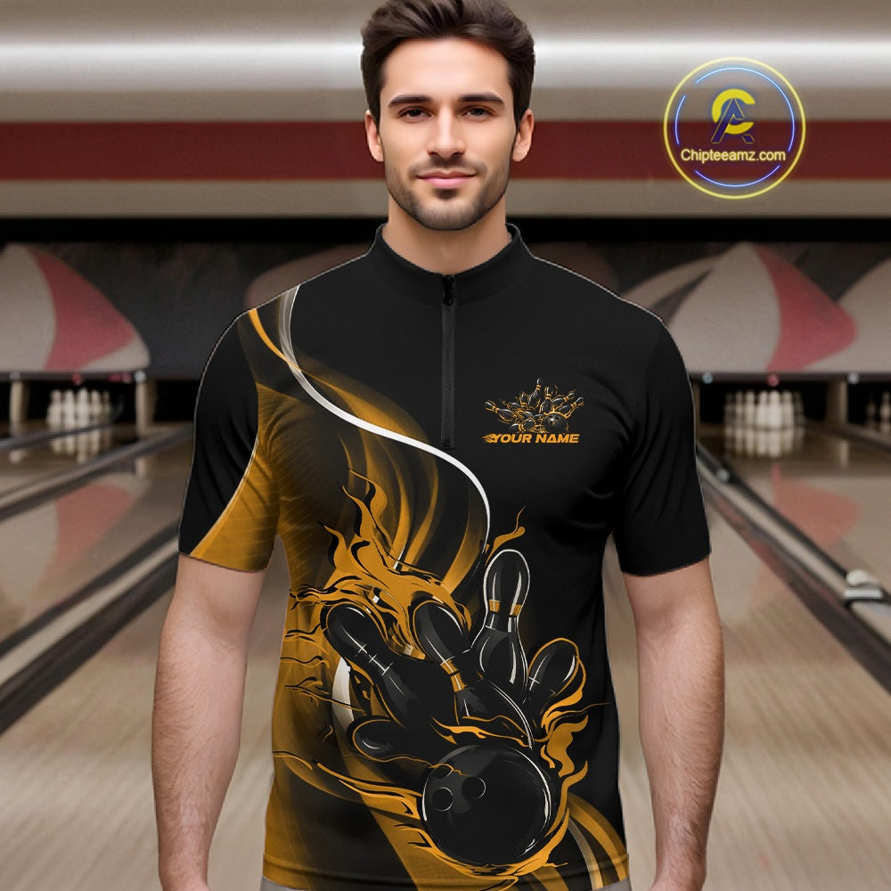 Male model front view at bowling lane wearing black and yellow quarter zip shirt with flame bowling strike graphics and energetic design