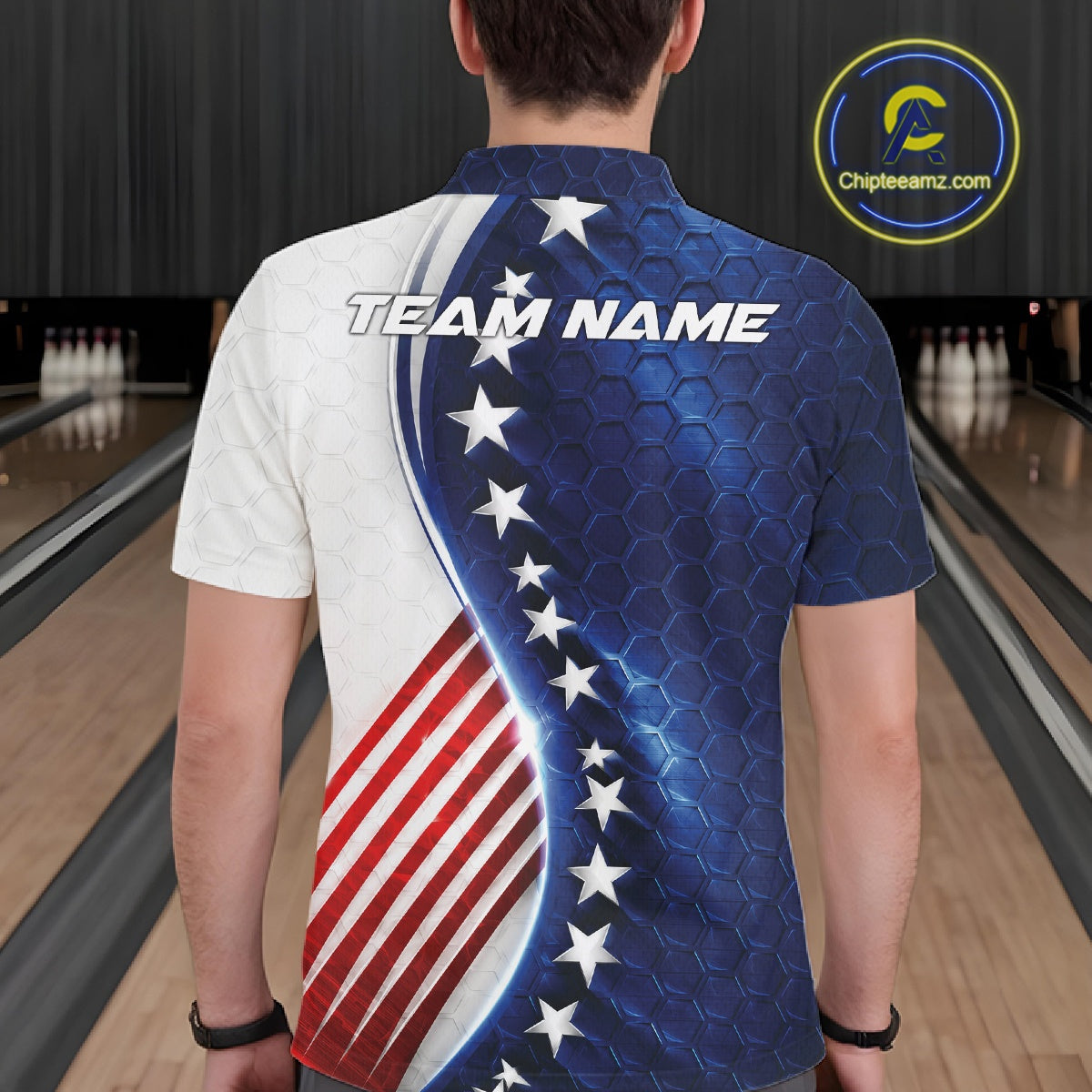A person viewed from behind wearing a short-sleeve collared shirt with an American flag-inspired design: white on the left side, blue with a honeycomb texture and white stars on the right, plus diagonal red and white stripes. The back has large placeholder text reading TEAM NAME.