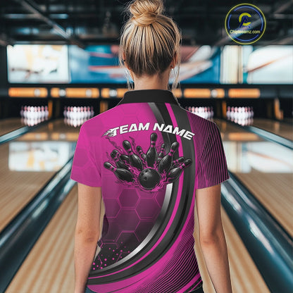 Back view of a female model in a bowling venue wearing a black and pink polo shirt, showcasing honeycomb pattern and flaming bowling action illustration.