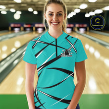 Load image into Gallery viewer, Front view of a female bowler in a bowling alley wearing a turquoise blue, black, and white bowling quarter-zip shirt with a sporty jersey design