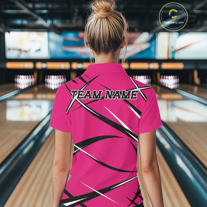 Back view of a female bowler wearing a pink, black, and white bowling quarter zip shirt with a sporty jersey look
