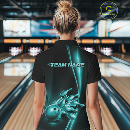 Back view of a female model in a bowling lane wearing a black polo shirt featuring turquoise blue bowling ball and pins artwork with athletic sports styling.