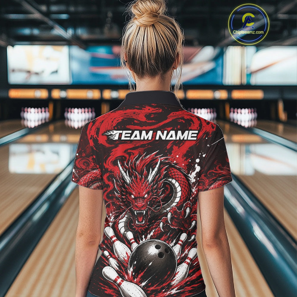 Person wearing a bowling shirt with a dragon design in a bowling alley