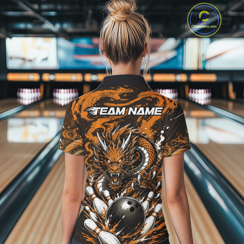 Person wearing a bowling shirt with a dragon design in a bowling alley