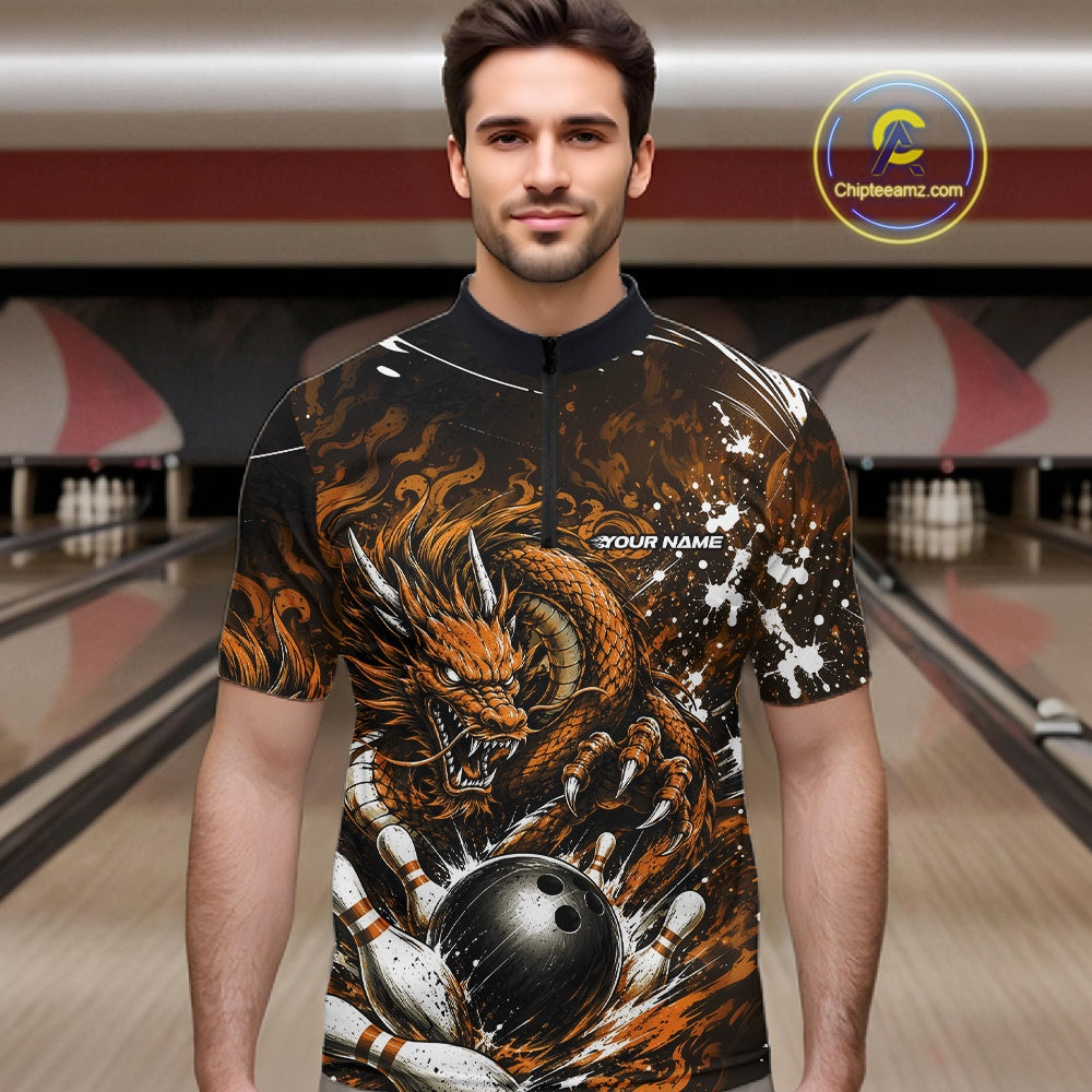 Man wearing a bowling shirt with a dragon design in a bowling alley.