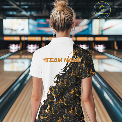 Back view of a female model in a bowling lane wearing a white quarter-zip shirt, featuring yellow and black flame bowling pattern with bold athletic bowling graphics.
