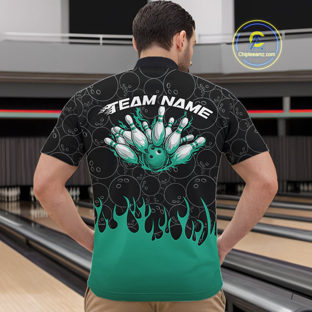 Male model in a bowling lane wearing black quarter zip shirt, front view showcasing bowling ball pattern with turquoise green flames and dynamic bowling artwork