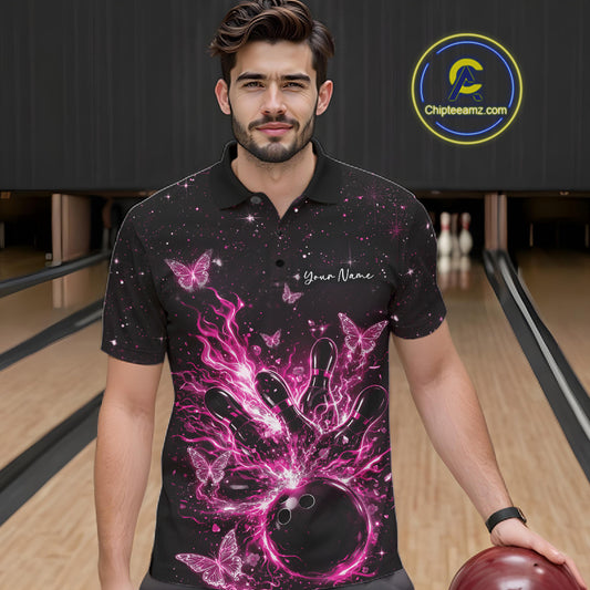 Male model in a black and pink bowling polo shirt at the lane with glowing butterfly strike artwork.