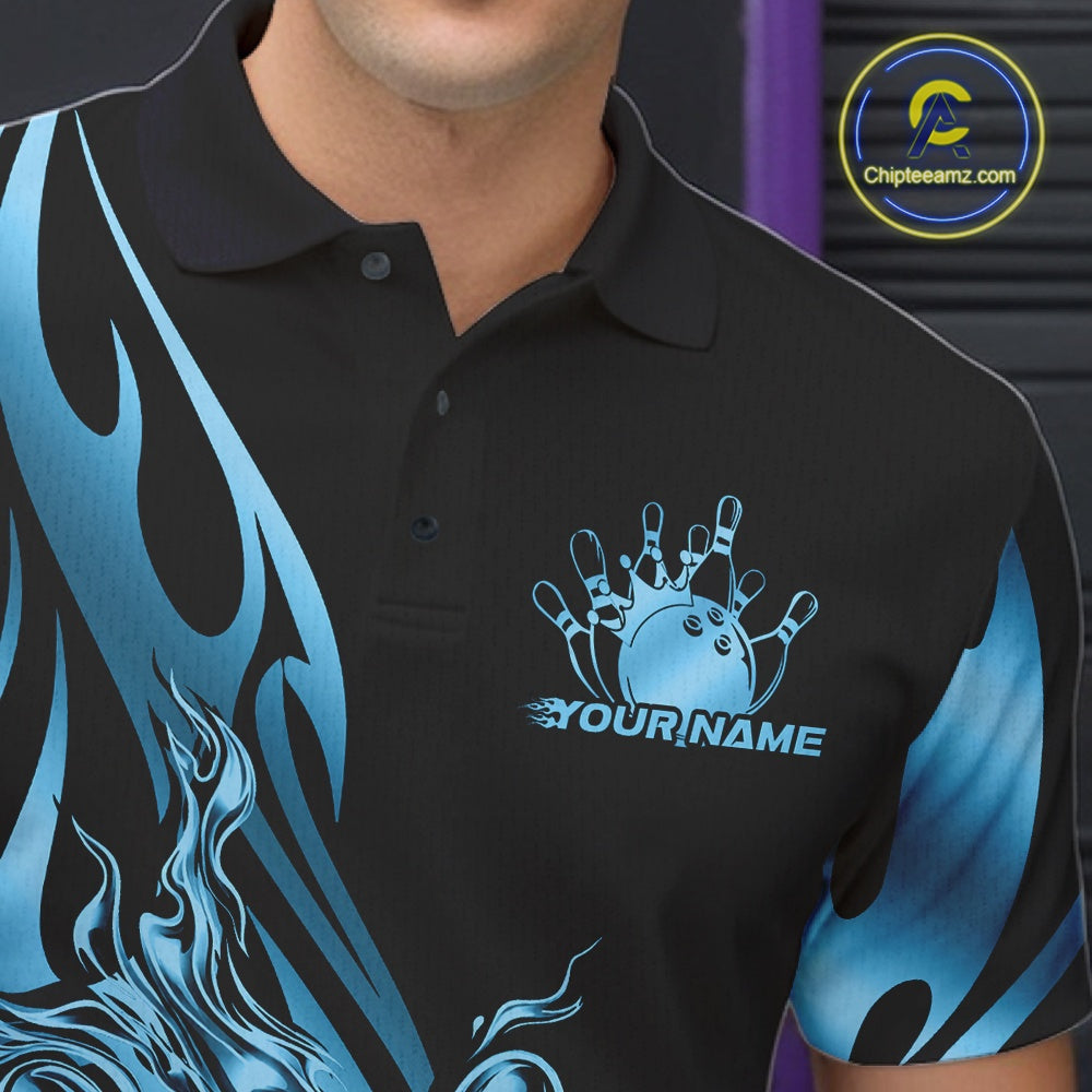 Close-up view of the left chest area of a black polo shirt showing a blue gradient tribal flame bowling ball and pins design detail.