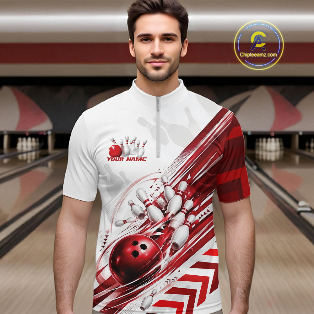 A man wearing a white and red bowling-themed short-sleeve quarter-zip shirt with bowling pins, balls, and dynamic graphic stripes. The background shows a blurred bowling alley with lanes and pins.