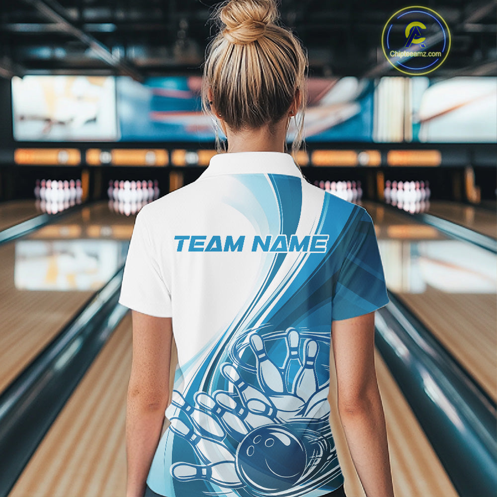 Back view of a women s white and blue bowling quarter zip showcasing flowing curve accents and a bowling ball crashing into pins graphic.
