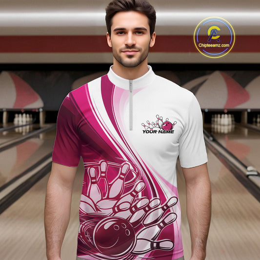 Male model in a bowling lane wearing a white and pink quarter zip shirt, showcasing a sweeping curve graphic with a bowling ball knocking down pins.