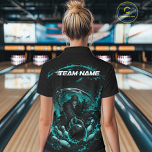 Load image into Gallery viewer, Back view of a female model wearing a black and cyan blue bowling quarter zip shirt showcasing a grim reaper with a blazing bowling ball striking scattered pins amid swirling flames in a bowling lane.