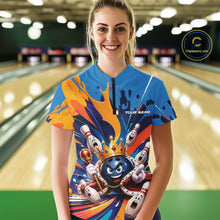 Load image into Gallery viewer, Front view of a female model wearing a bowling quarter zip shirt featuring a crowned cartoon bowling ball holding a royal scepter with cheering animated bowling pins and colorful paint splashes in a bowling lane.