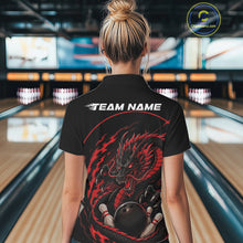 Load image into Gallery viewer, Back view of a female model in a bowling alley wearing a red custom bowling polo shirt featuring an aggressive dragon with flames in a dynamic and energetic design.