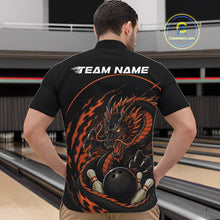 Load image into Gallery viewer, Back view of a male model in a bowling alley wearing an orange custom quarter-zip bowling shirt featuring an aggressive dragon with flames in a dynamic and energetic design.