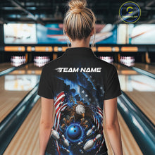 Load image into Gallery viewer, Back view female model at the bowling lane wearing a quarter zip shirt with bald eagle gripping a blue bowling ball, flying pins, and American flag background.